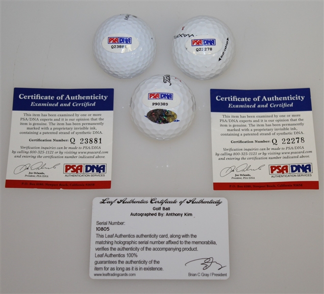 Anthony Kim, Andres Romero, & Aaron Baddeley Signed Golf Balls PSA/DNA & Leaf