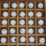 100 Assorted Logo Golf Balls with Golf Ball Display Case