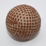 A Red Painted Silvertown Mesh-Patterned Gutty Golf Ball