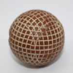 A Red Painted Silvertown Mesh-Patterned Gutty Golf Ball