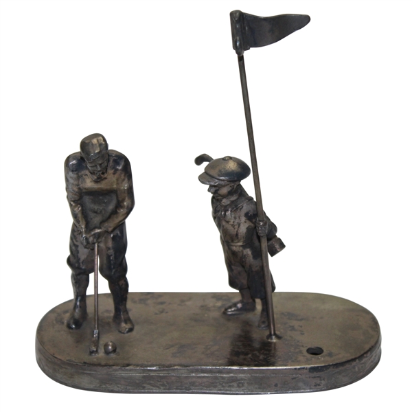 Golfer Setting Up for Putt To Hole with Caddy & Flag Stick