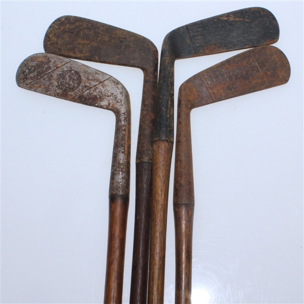 Four Classic Hickory Golf Clubs