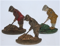 Three Vintage Cast Iron Golfer Themed Doorstops - Red, Yellow, and Brass - Roth Collection
