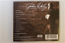 Signed John Daly Polo, Golf Glove, And CD  - JSA AOLA