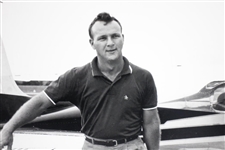 Arnold Palmer B&W 16x16 Matted Photo Carrying Golf Bag with Clubs Leaving Plane
