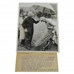 President Eisenhower Putting on Rain Gear with Sam Snead Holding Umbrella 7 1/8x9 Wire Photo