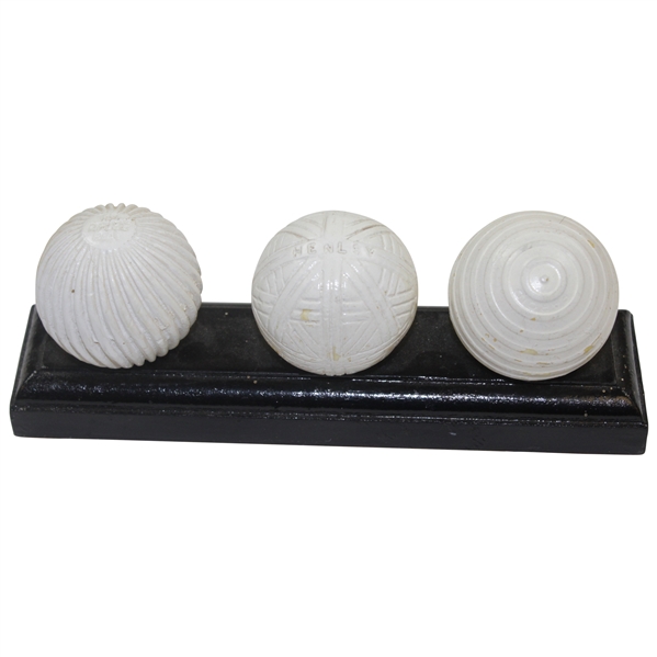 Facsimile Golf Balls On Wooden Stand