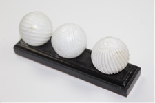 Facsimile Golf Balls On Wooden Stand