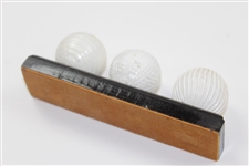 Facsimile Golf Balls On Wooden Stand