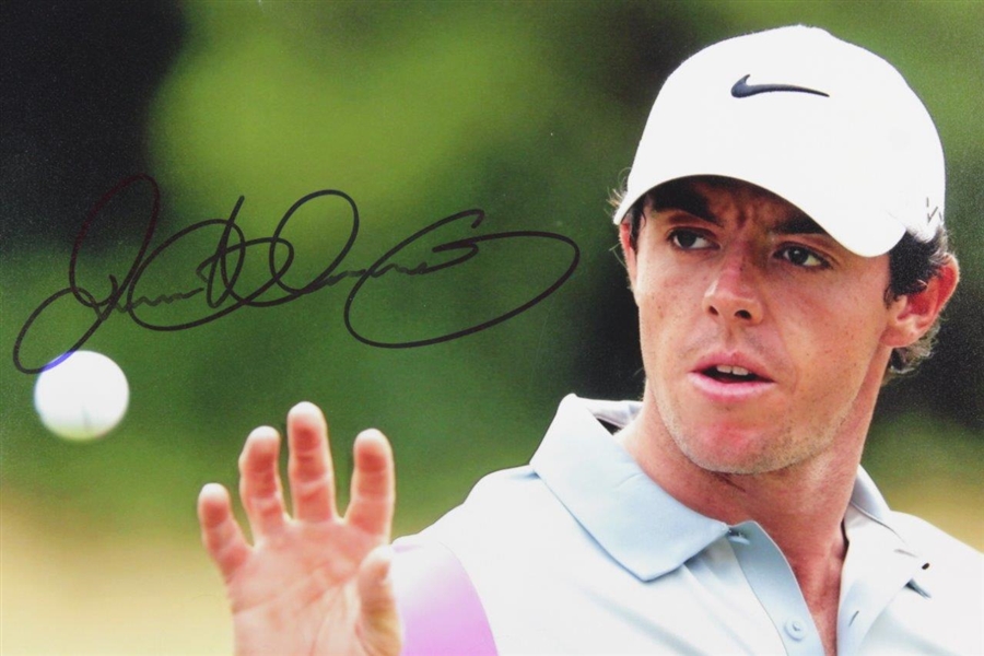 Rory McIlroy Signed Photo at The 2014 Open at Royal Liverpool Eyeing The Ball JSA ALOA