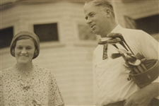 Maureen Orcutt's Original in Augusta (Montell)Photo - With Gentleman Holding Golf Bag with Clubs