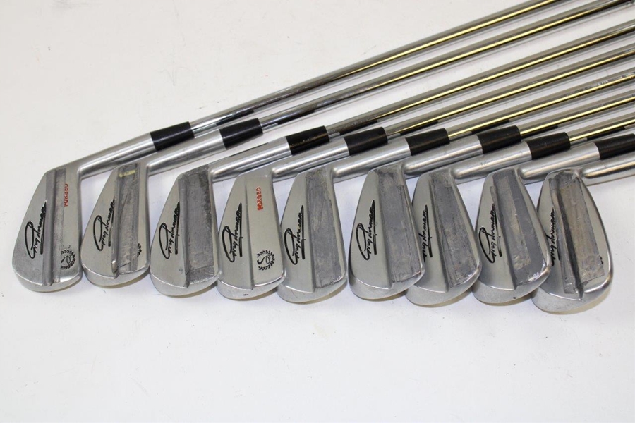 Greg Norman's Personal Used Set of COBRA Greg Norman Signature Forged Irons with Lead Tape 2-PW