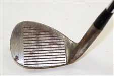 Greg Norman's Personal Used Unmarked Pitching Wedge with Lead Tape
