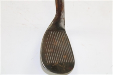 Greg Norman's Personal Used Unmarked Pitching Wedge with Lead Tape