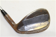 Greg Norman's Personal Used Unmarked Pitching Wedge with Lead Tape