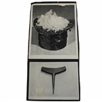 Photo With Tool For Making Golf Balls And A Top Hat With Feathers Inside