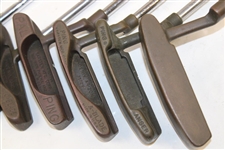 Ten (10) Various Putters Including Eight (8) Assorted PING Putters, a Brass Playboy & a Woodie Putter