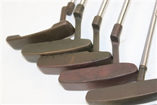 Ten (10) Various Putters Including Eight (8) Assorted PING Putters, a Brass Playboy & a Woodie Putter