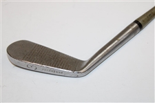 Babe 'Didrickson' Zaharias’ Personal Model MacGregor 3-Iron with Auction Program & Tag - Attributed