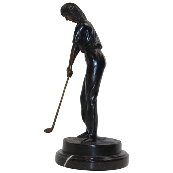 Statue Of Female Golfer Lining Up An Iron Shot 