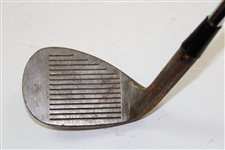 Greg Norman's Personal Used Unmarked Pitching Wedge with Lead Tape