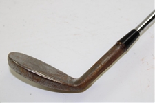 Greg Norman's Personal Used Unmarked Pitching Wedge with Lead Tape