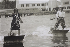 Vintage Female & Male Golfers Crossing River on 'Aquaplanes' with Clubs & Bags 8x10 Wire Photo