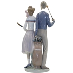 Statue Of Male & Female Golfers by Llardro
