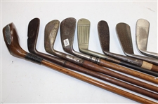 Eight (8) Wood Shaft Clubs 1 Wood L.H. Brassie, Putter Bin Bamboo Shaft, L.H Wilson Diamond Back, 1 Brass Putter Steel Shaft, Jigger Macgregor & Others