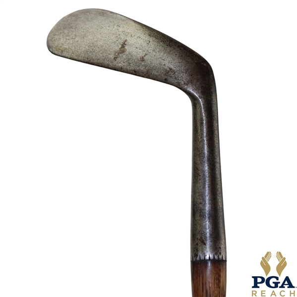The Spalding Mussel Back Lofting Mashie