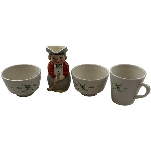 A Group of Ceramic Golf-Themed Tableware and a Figural Character Jug