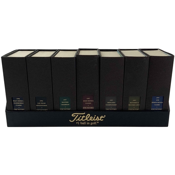 A Set of Seven Tiger Woods Titleist Commemorative Limited Edition Golf Ball Box Sets with Display Rack