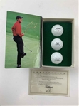 A Set of Seven Tiger Woods Titleist Commemorative Limited Edition Golf Ball Box Sets with Display Rack