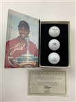 A Set of Seven Tiger Woods Titleist Commemorative Limited Edition Golf Ball Box Sets with Display Rack
