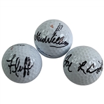 A Trio of Golf Balls Signed by Tiger Woods Caddies Mike Fluff Cowan Steve Williams and Joe LaCava JSA ALOA