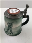 A Pair of Early 1900's O'Hara Dial Co. Collegiate Golf Theme Lidded Steins