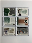 A Collection of Twenty Three Upper Deck Golf Memorabilia Trading Cards Featuring Authentic Fabric Swatches 2001-2003