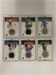 A Collection of Twenty Three Upper Deck Golf Memorabilia Trading Cards Featuring Authentic Fabric Swatches 2001-2003