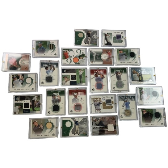 A Collection of Twenty Three Upper Deck Golf Memorabilia Trading Cards Featuring Authentic Fabric Swatches 2001-2003