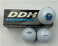A Collection of Themed Collectible Golf Balls and Original Packaging including Dunlop Titleist Ram and Pinnacle