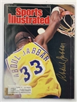A Collection of Los Angeles Lakers Memorabilia Including Signed Sports Illustrated Magazines and Promotional Items