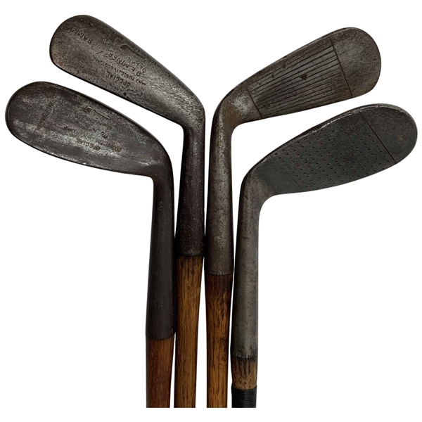 A Set of Four Antique Hickory Shaft Golf Clubs Including Tom Stewart St. Andrews Irons