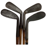 A Set of Four Antique Hickory Shaft Golf Clubs Including Tom Stewart St. Andrews Irons