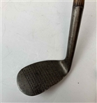 A Set of Four Antique Hickory Shaft Golf Clubs Including Tom Stewart St. Andrews Irons