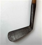 A Set of Four Antique Hickory Shaft Golf Clubs Including Tom Stewart St. Andrews Irons