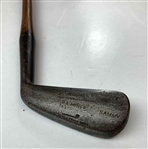 A Set of Four Antique Hickory Shaft Golf Clubs Including Tom Stewart St. Andrews Irons