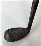 A Set of Four Antique Hickory Shaft Golf Clubs Including Tom Stewart St. Andrews Irons