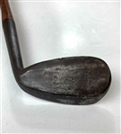 A Set of Four Antique Hickory Shaft Golf Clubs Including Tom Stewart St. Andrews Irons
